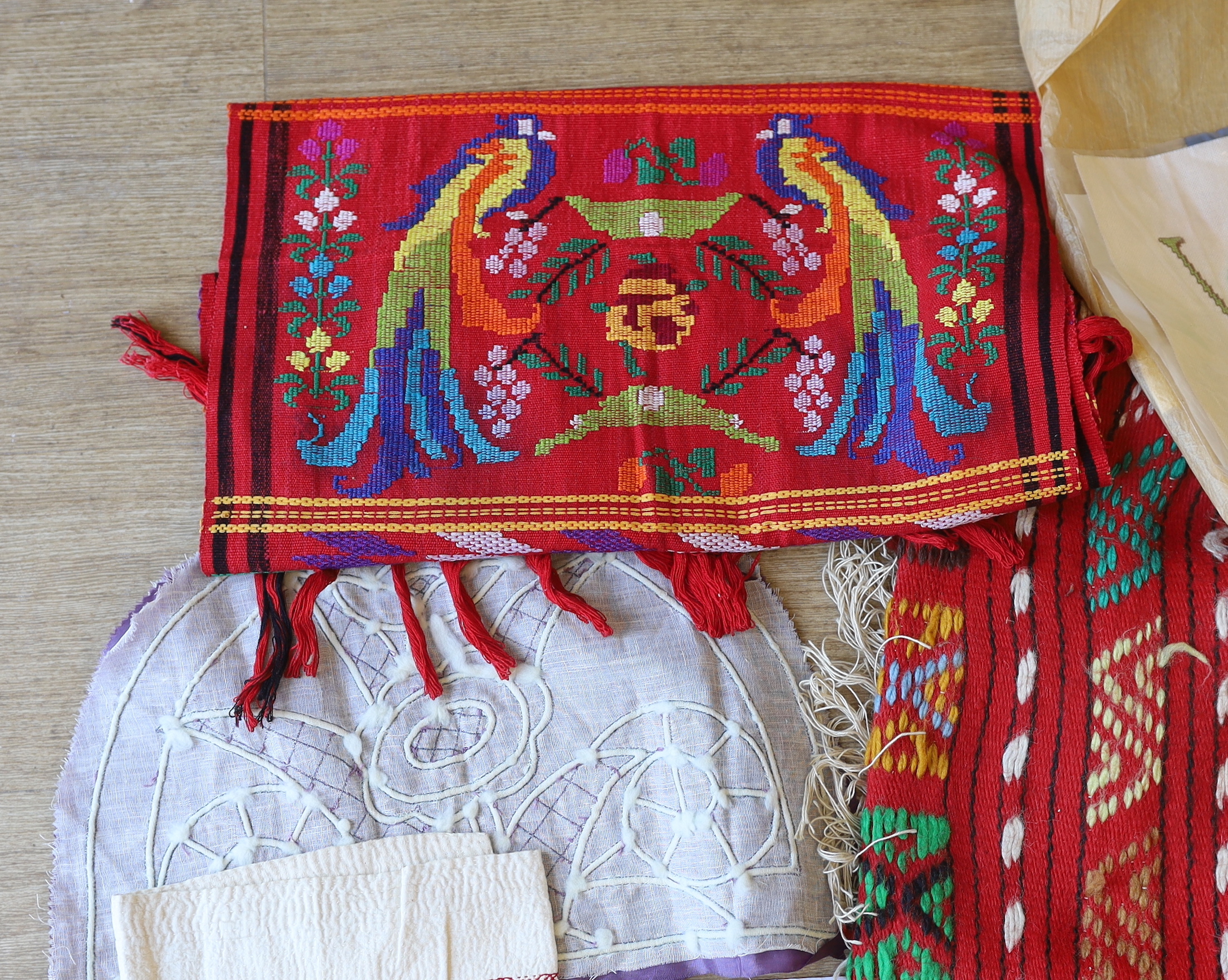 A cotton printed African religious commemorative panel, dated 1897-1957, together with various samples of types of quilting, hand painted silk and woven textiles